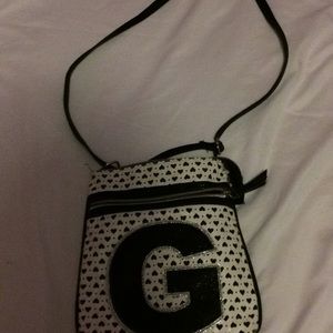 A cross body g initial purse sparkly